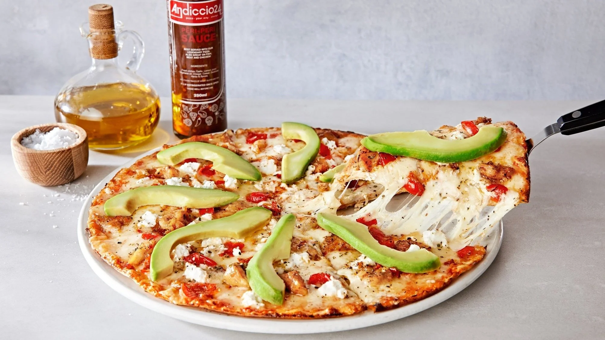 Food styling a cheesy pizza pull for Andiccio24