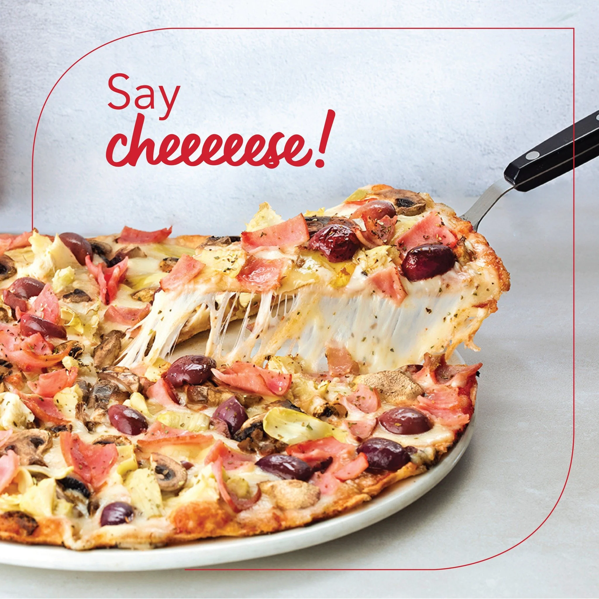 Food styling a Four Seasons cheesy pizza pull for Andiccio24