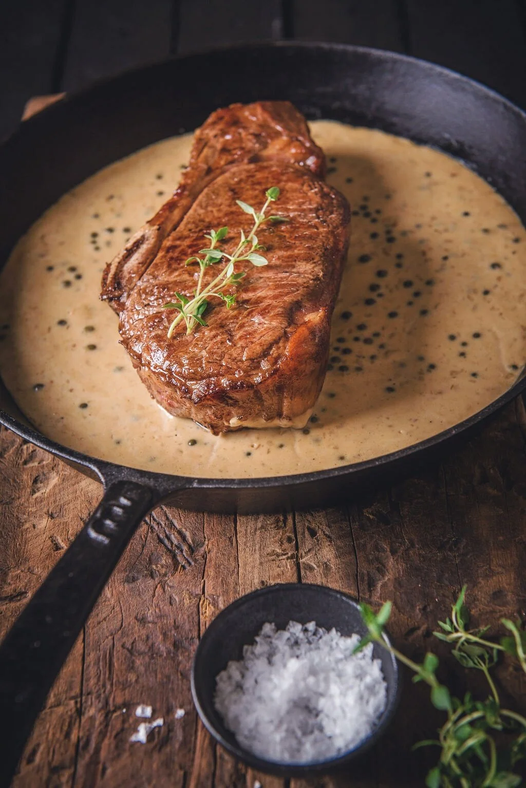 Ribeye on the Bone in a Creamy Peppercorn Sauce