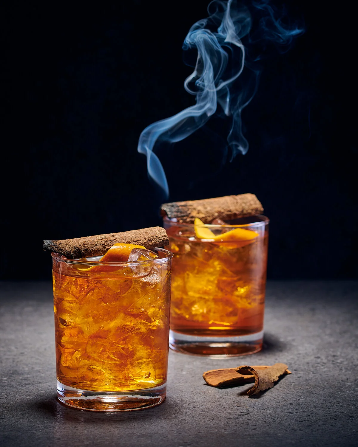 Smoked cinnamon old fashioned cocktails styled for Airport Craft Brewers restaurant. Drink styling by Bianca Delides. Photographed by Dylan Swart.