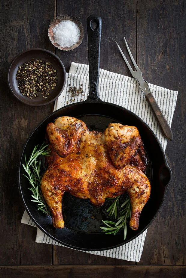 Whole roast chicken flattie styled for Butcher Block Steakhouse. Food styling by Bianca Delides. Photographed by Rikki Hibbert.