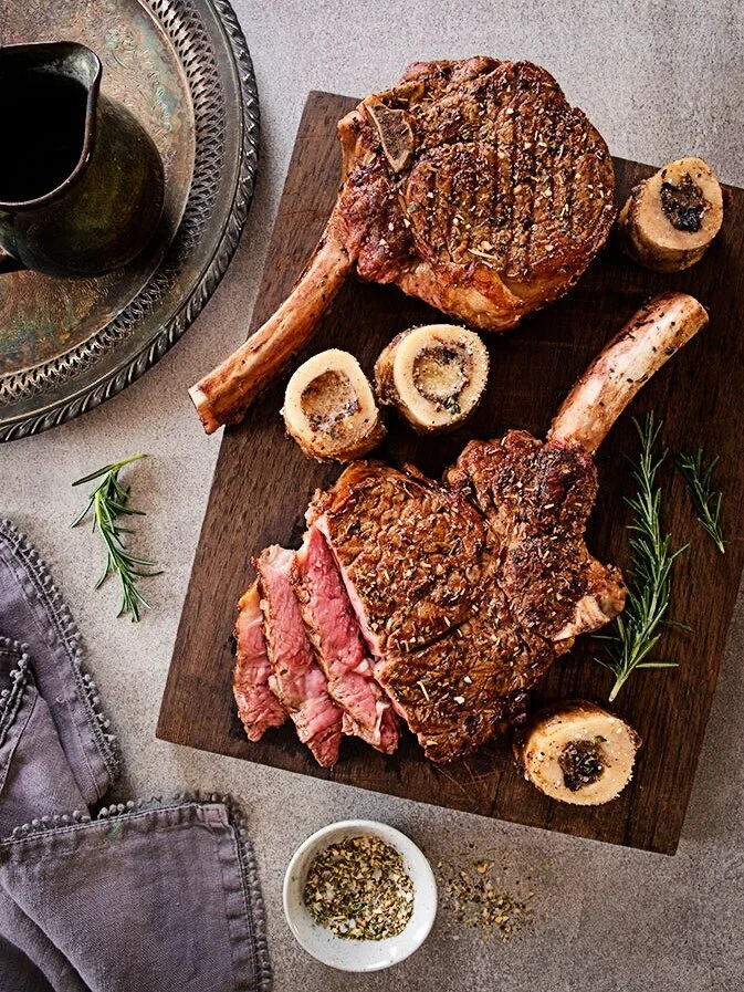 Herb-Rubbed Ribeye Steaks with Roasted Bone Marrow