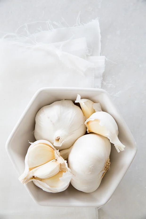 Garlic. Black and white conceptual food shoot. Food styling by Bianca Delides. Photographed by Rikki Hibbert.